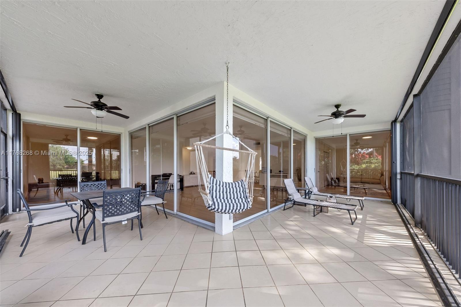 7658 Elm Ridge Drive, Unit 17U Boca Raton, FL 33433 - Photo 34 of 39 PATIO THAT GOES AROUND ENTIRE CONDO