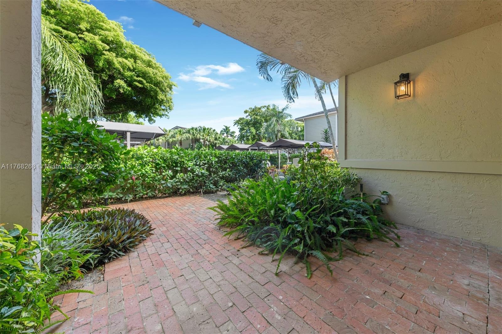 7658 Elm Ridge Drive, Unit 17U Boca Raton, FL 33433 - Photo 7 of 39 WALKWAY INTO CONDO