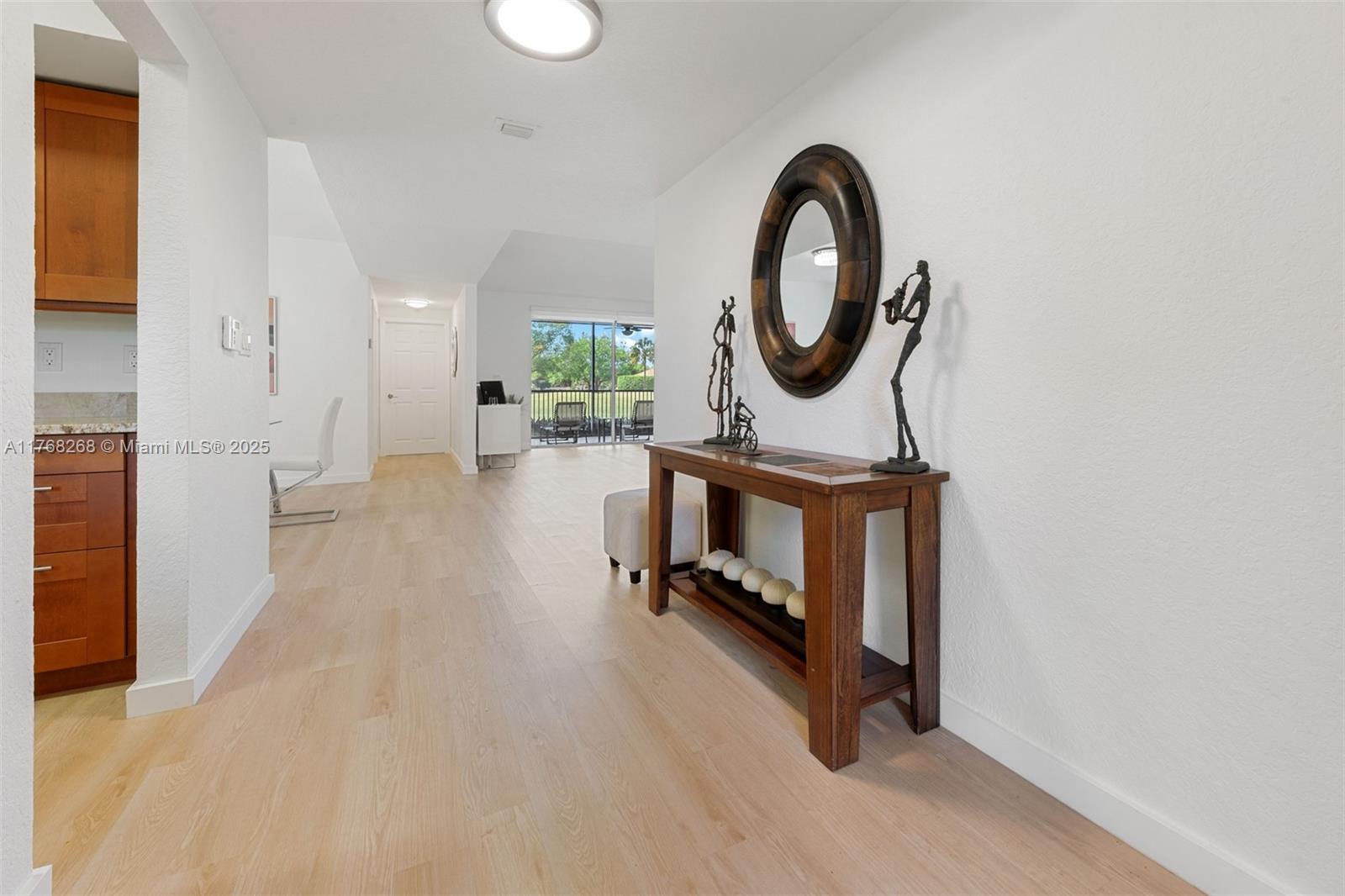 7658 Elm Ridge Drive, Unit 17U Boca Raton, FL 33433 - Photo 9 of 39 VIEW FROM FOYER INTO LIVING ROOM