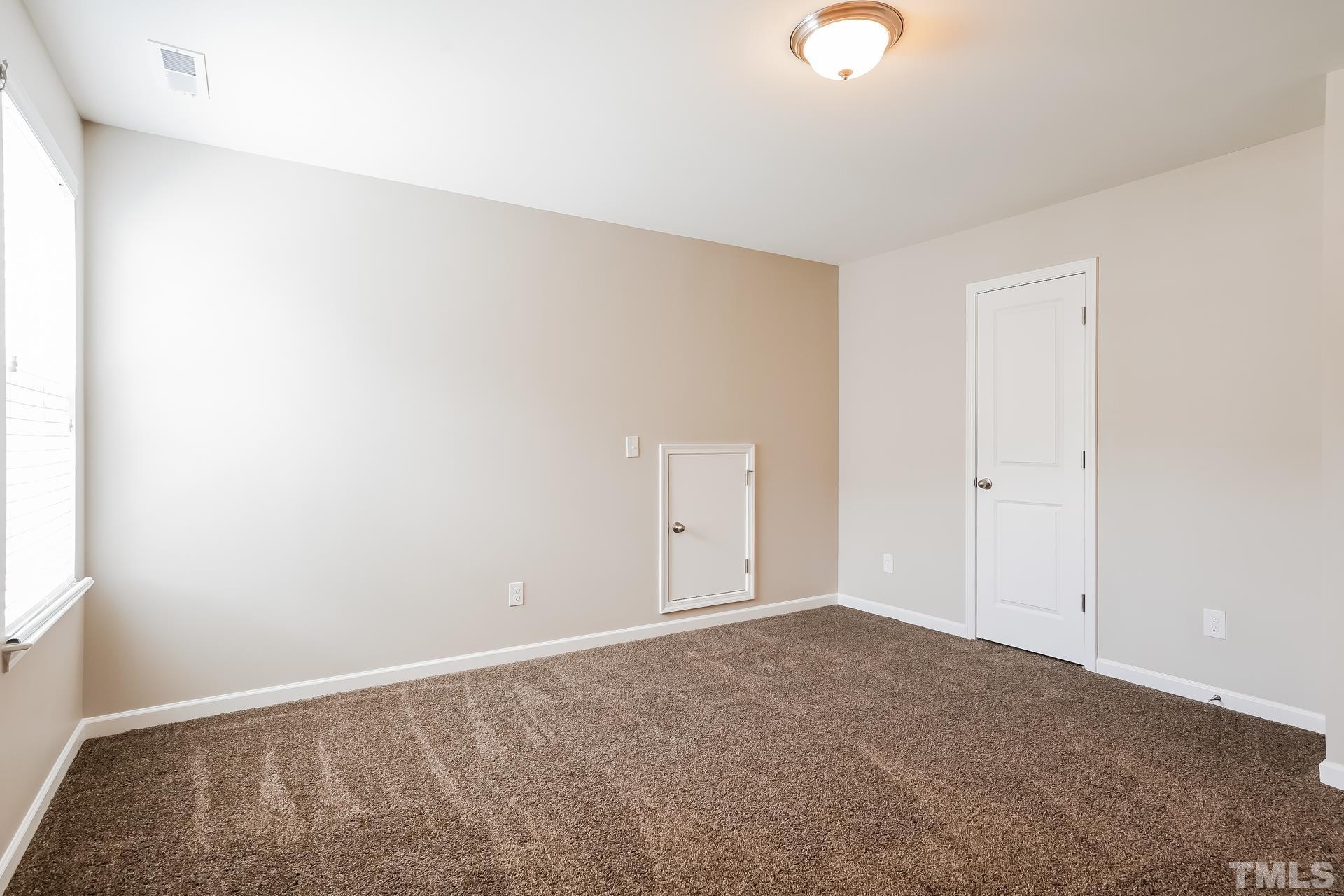 901 Rose Mallow Drive Zebulon, NC 27597 - Photo 13 of 15 a view of an empty room