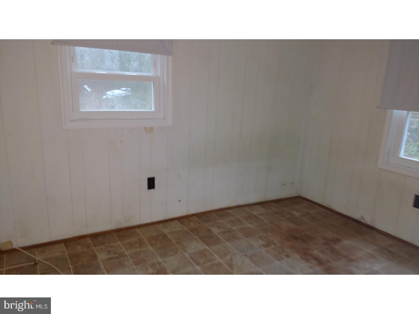 14122 Oak Branch Road Delmar, DE 19940 - Photo 8 of 25 a open area with a cabinet