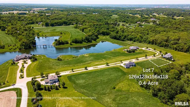 an aerial view of residential houses with outdoor space and swimming pool