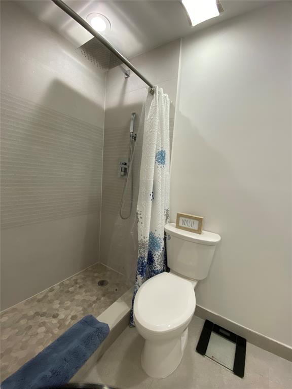 2420 Southwest 11th Street, Unit B Miami, FL 33135 - Photo 6 of 12 a bathroom with a sink and a toilet