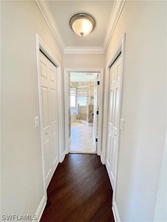 10816 Marble Brook Boulevard Lehigh Acres, FL 33936 - Photo 18 of 41 a view of a hallway with wooden floor and a bathroom