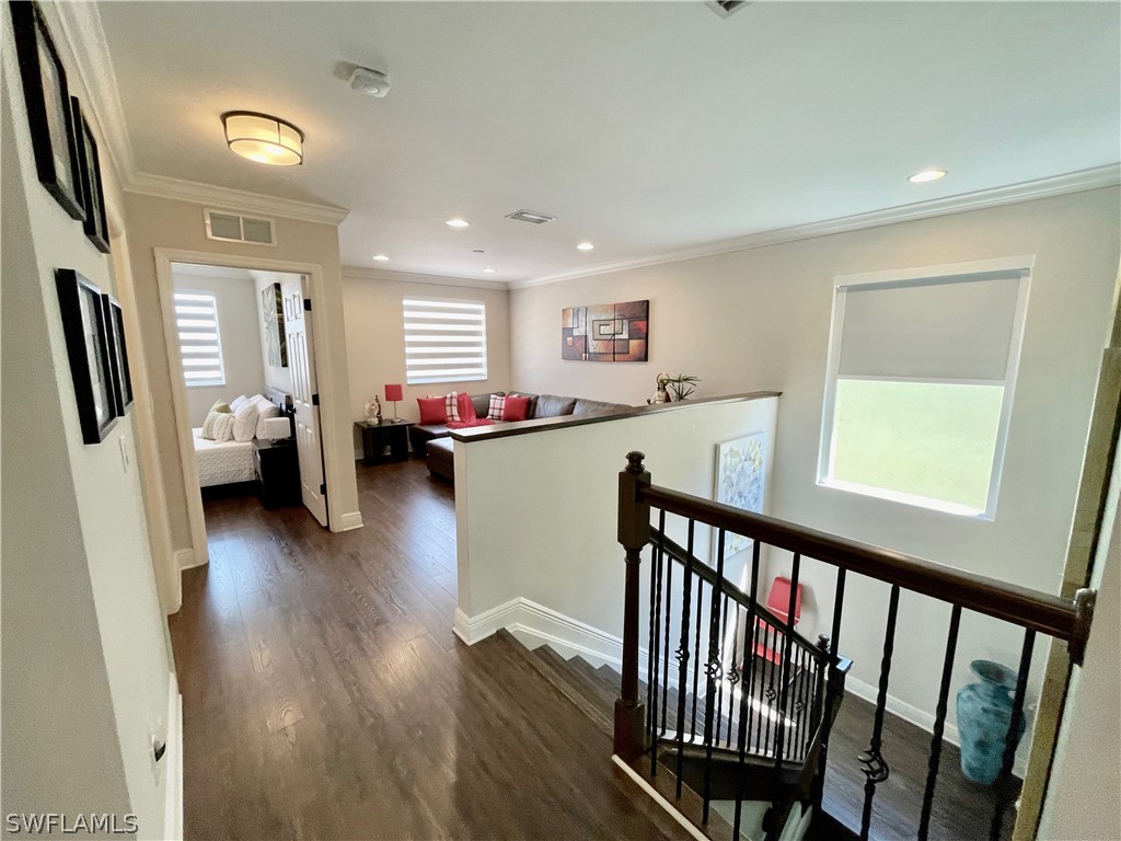 10816 Marble Brook Boulevard Lehigh Acres, FL 33936 - Photo 20 of 41 a view of living room with furniture and wooden floor