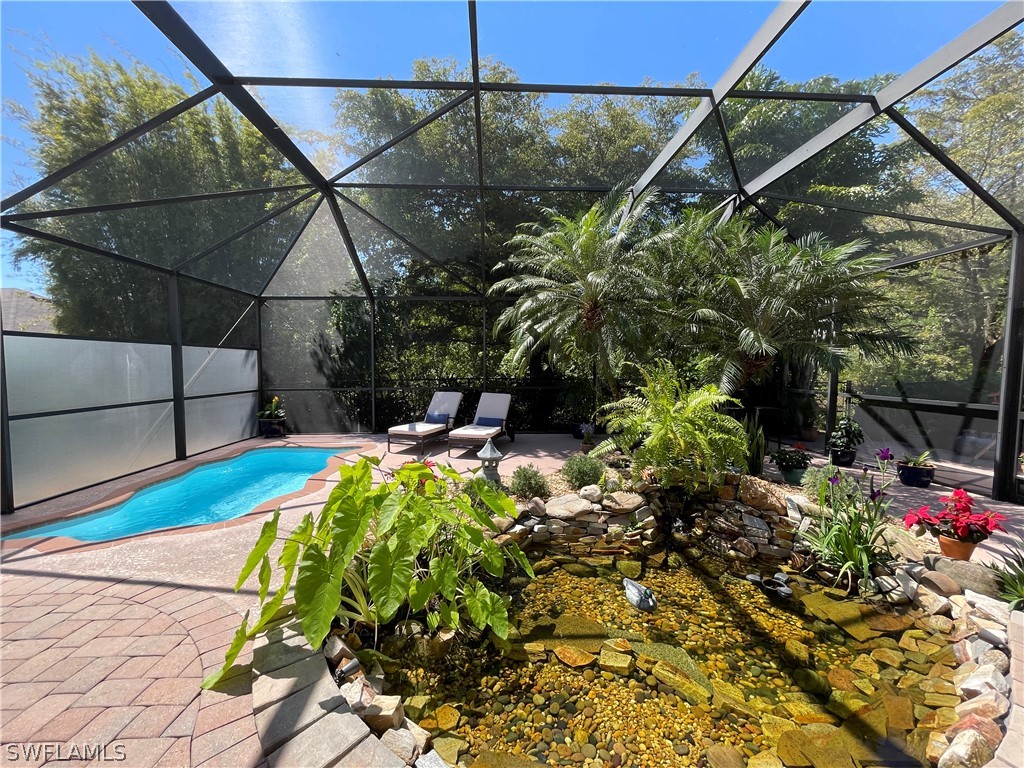 10816 Marble Brook Boulevard Lehigh Acres, FL 33936 - Photo 25 of 41 a view of a backyard