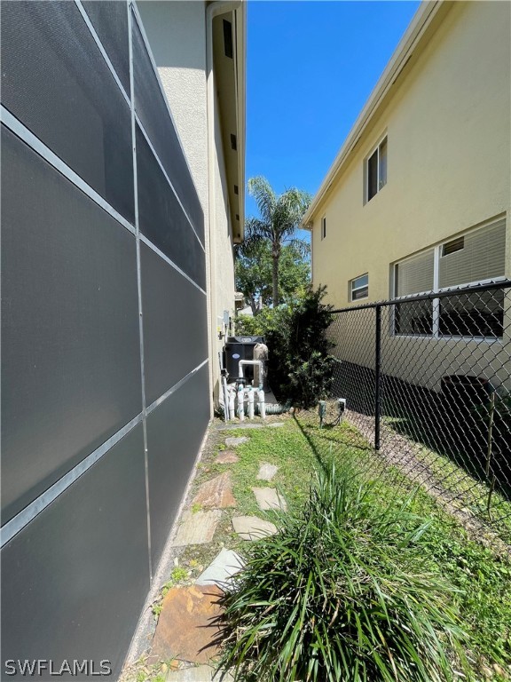 10816 Marble Brook Boulevard Lehigh Acres, FL 33936 - Photo 33 of 41 a view of a backyard with sitting area