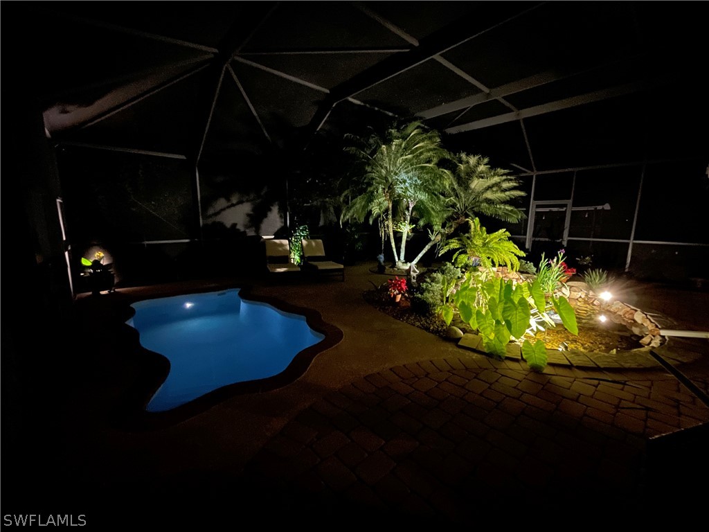 10816 Marble Brook Boulevard Lehigh Acres, FL 33936 - Photo 39 of 41 a view of a chair and table on the deck