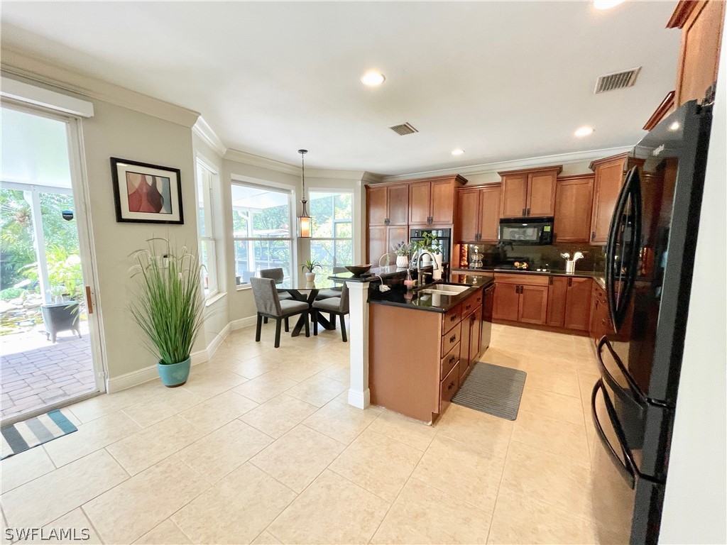 10816 Marble Brook Boulevard Lehigh Acres, FL 33936 - Photo 9 of 41 a view of a living room and dining room