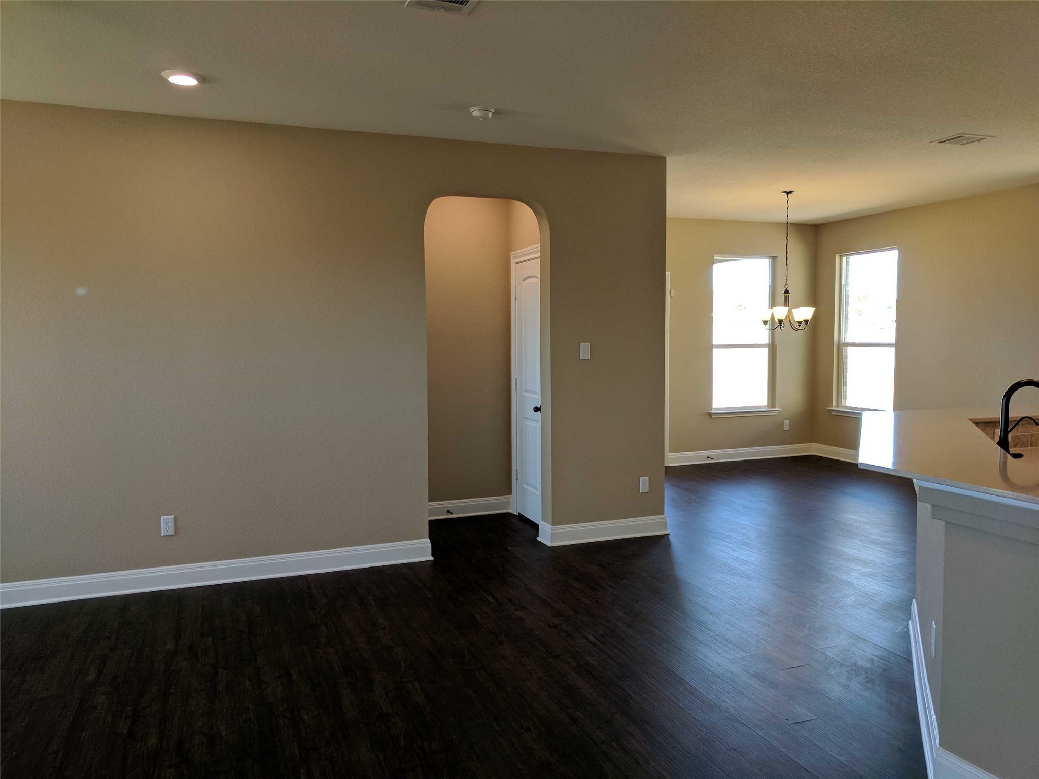 2471 Sunrise Road, Unit 8 Round Rock, TX 78664 - Photo 3 of 13 Spacious interior with dark wood-finish flooring, neutral wall tones, and recessed lighting
