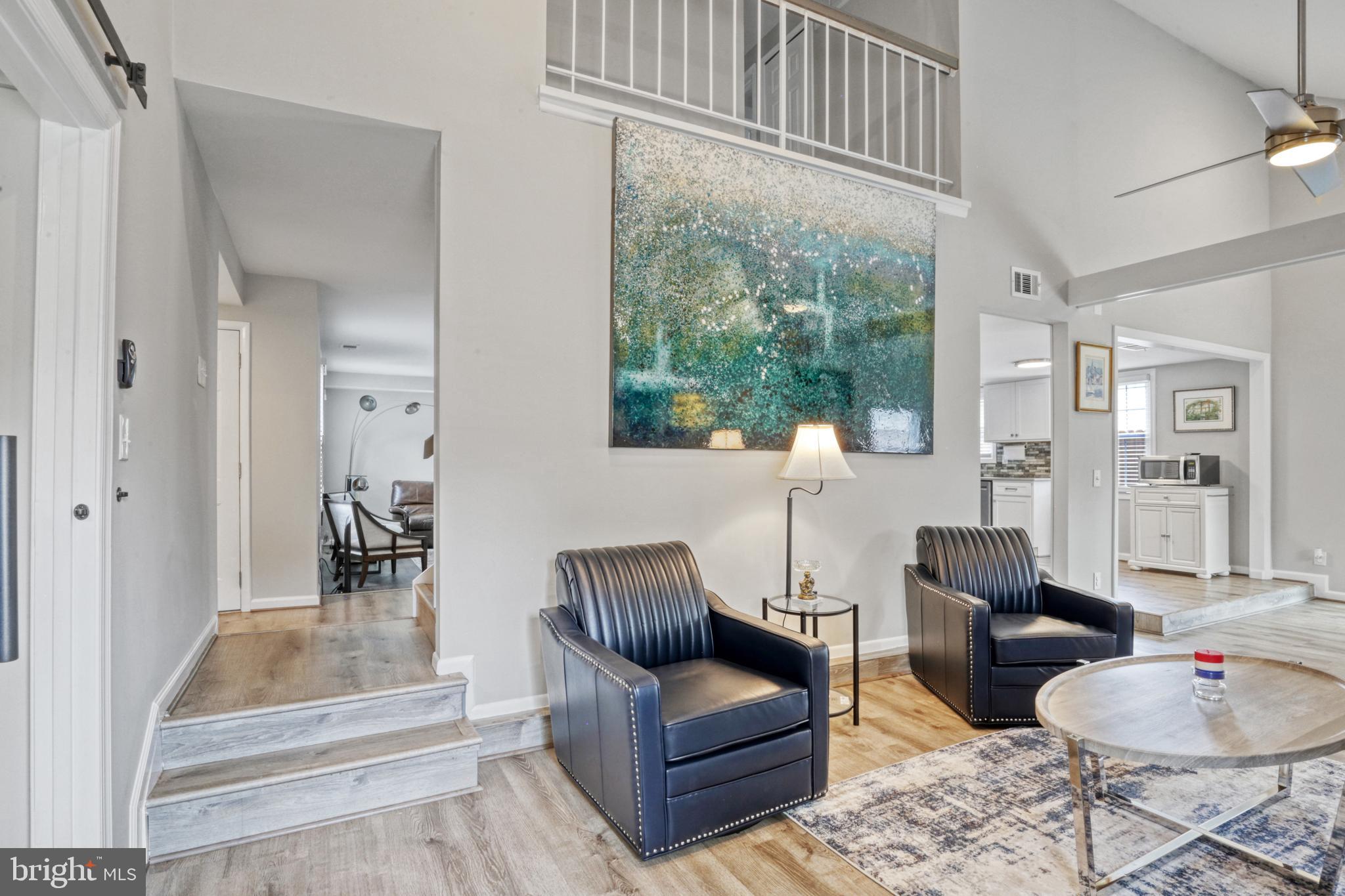 103 Cherry Tree Court Sterling, VA 20164 - Photo 15 of 32 a living room with furniture and a large window