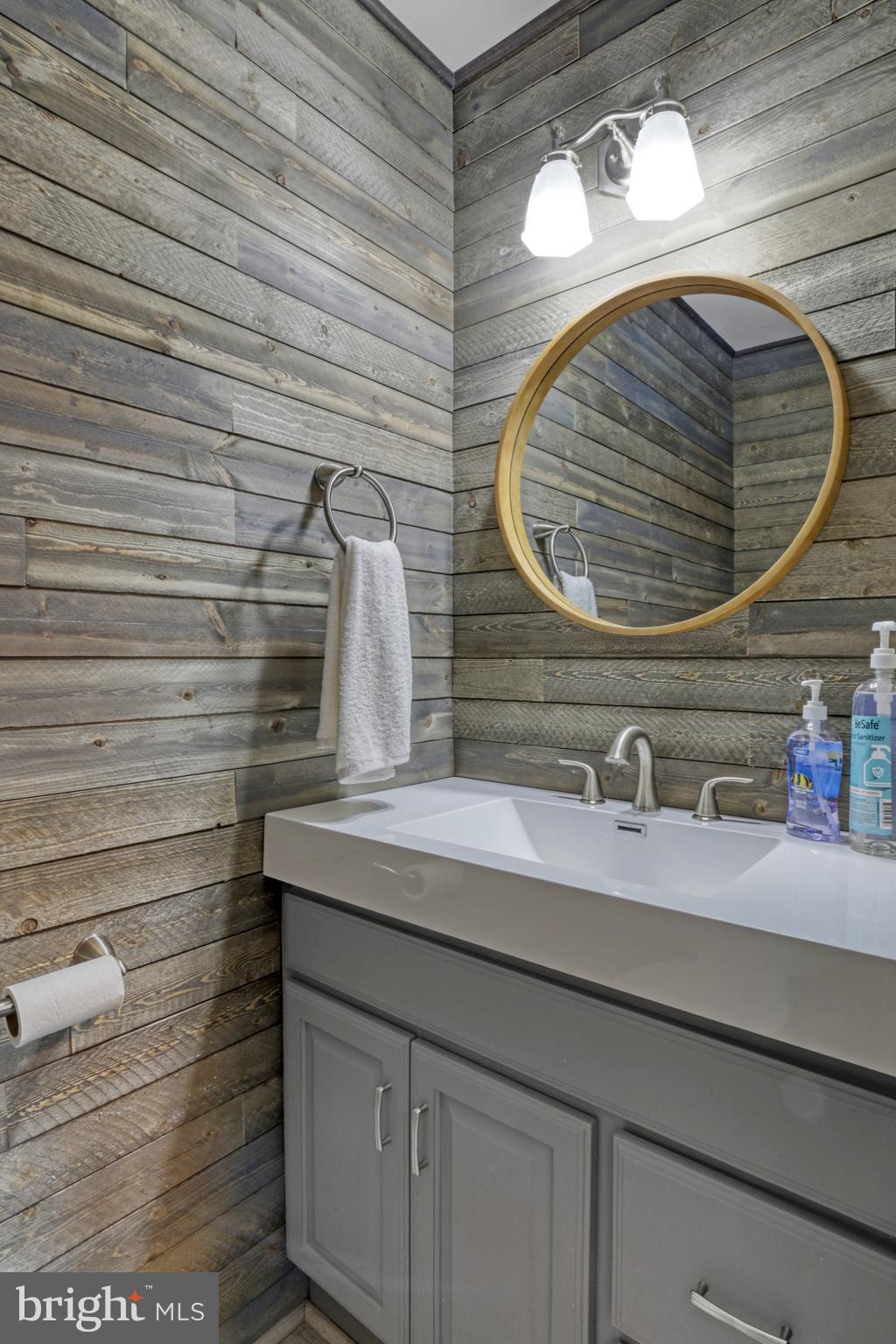 103 Cherry Tree Court Sterling, VA 20164 - Photo 17 of 32 a bathroom with a sink and a mirror