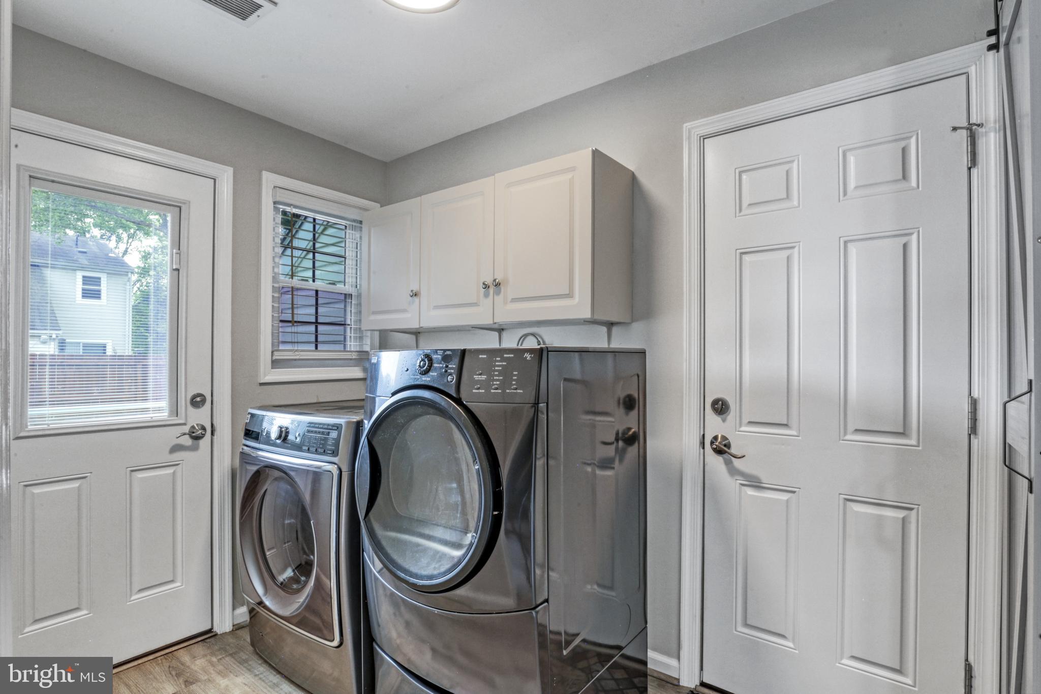 103 Cherry Tree Court Sterling, VA 20164 - Photo 18 of 32 a view of a storage and utility room with washer and dryer