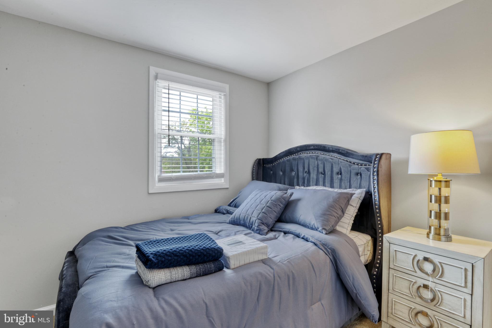 103 Cherry Tree Court Sterling, VA 20164 - Photo 20 of 32 a bedroom with a bed and a window