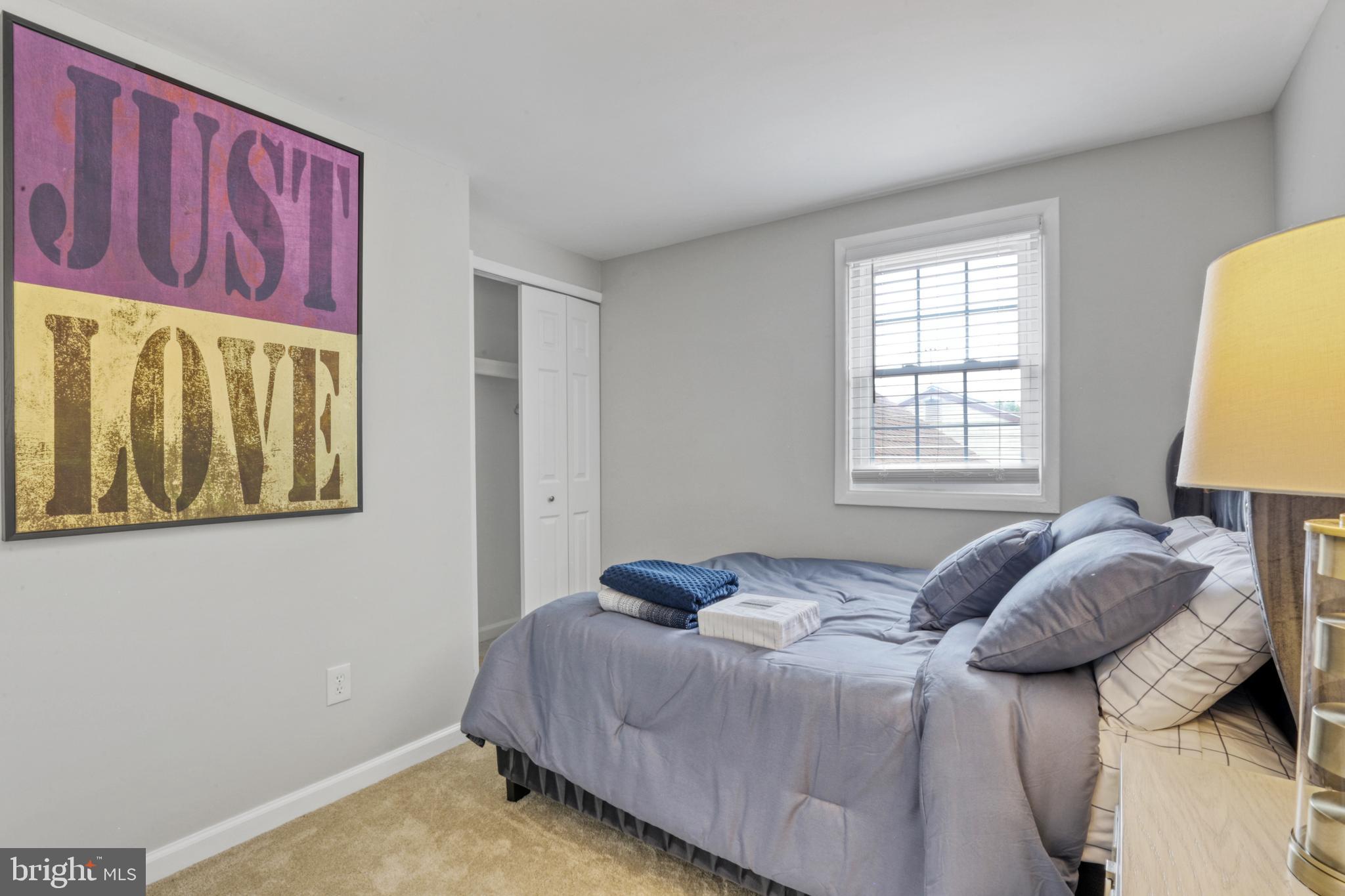103 Cherry Tree Court Sterling, VA 20164 - Photo 21 of 32 a bedroom with a bed and a window