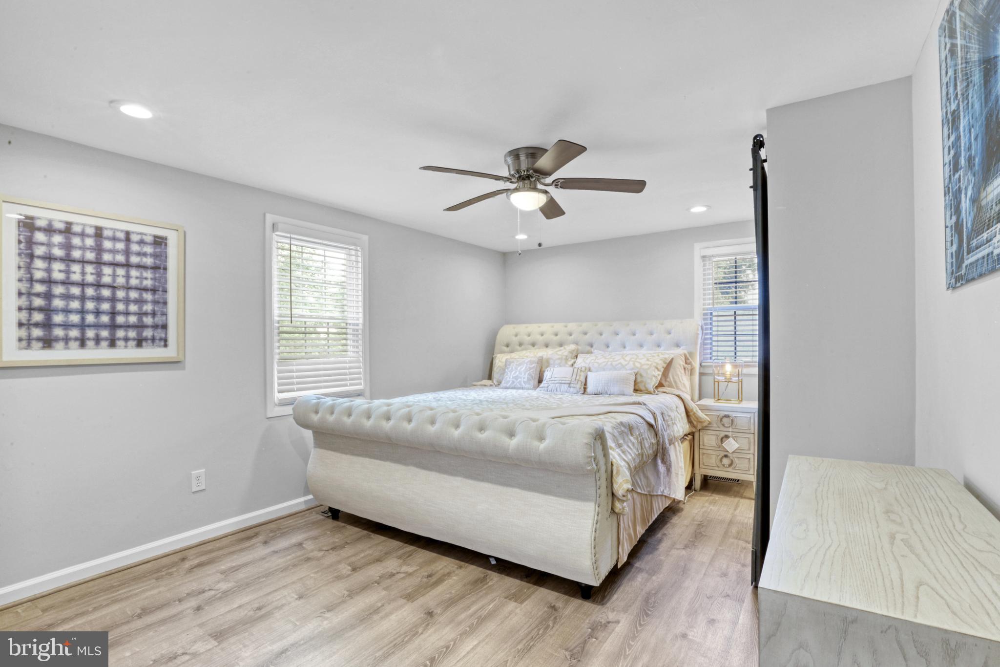 103 Cherry Tree Court Sterling, VA 20164 - Photo 26 of 32 a bed room with a bed and a ceiling fan