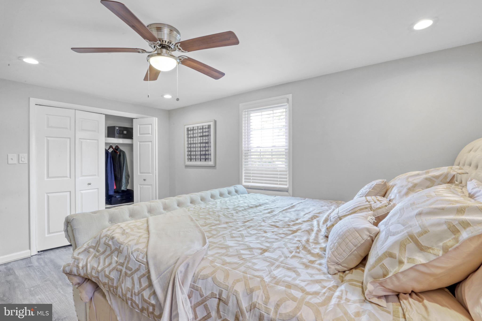 103 Cherry Tree Court Sterling, VA 20164 - Photo 28 of 32 a bedroom with a large bed and a window