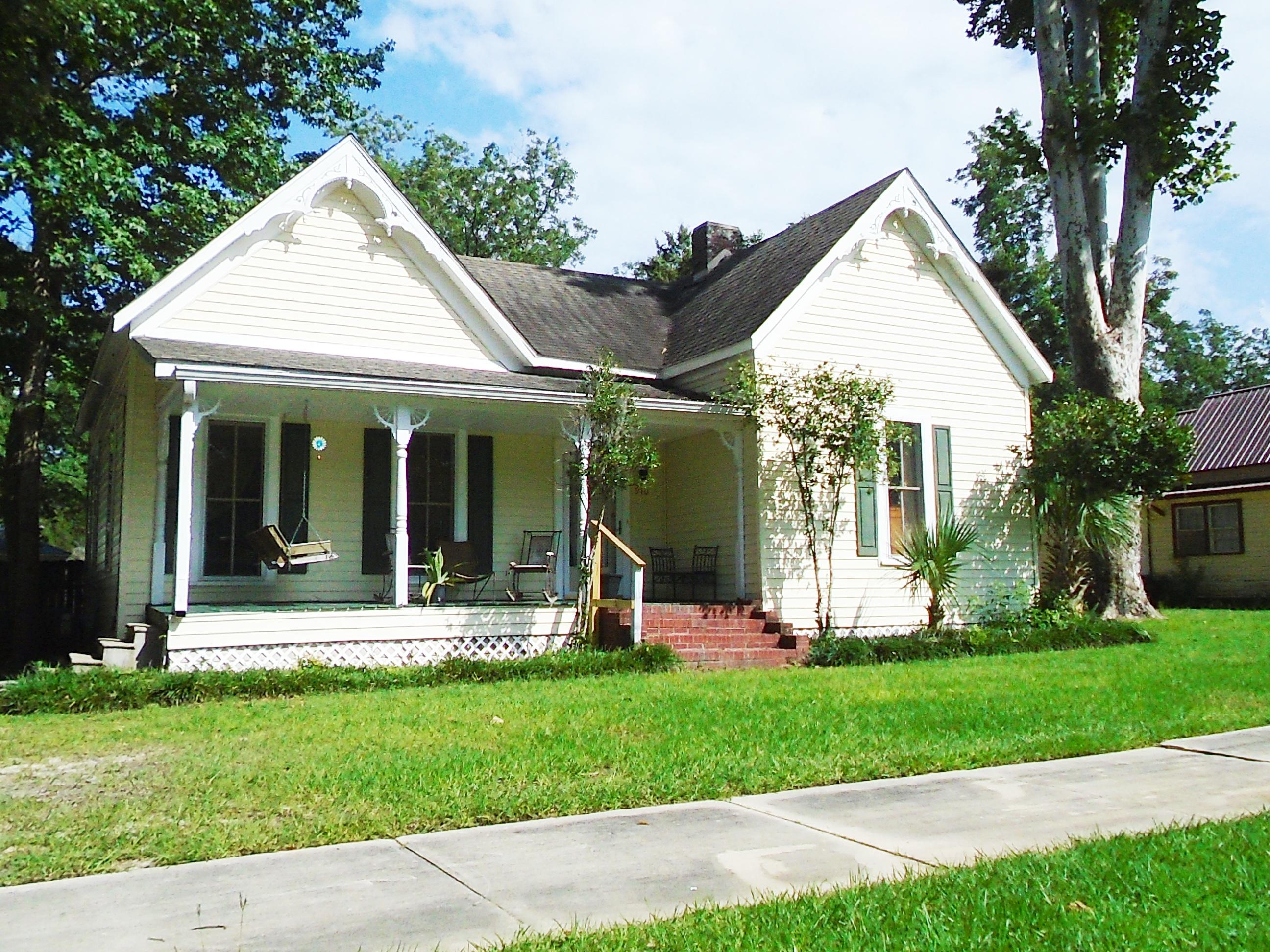 910 5th Street Florala, AL 36442 - Photo 16 of 34 a view of a house with a yard and plants