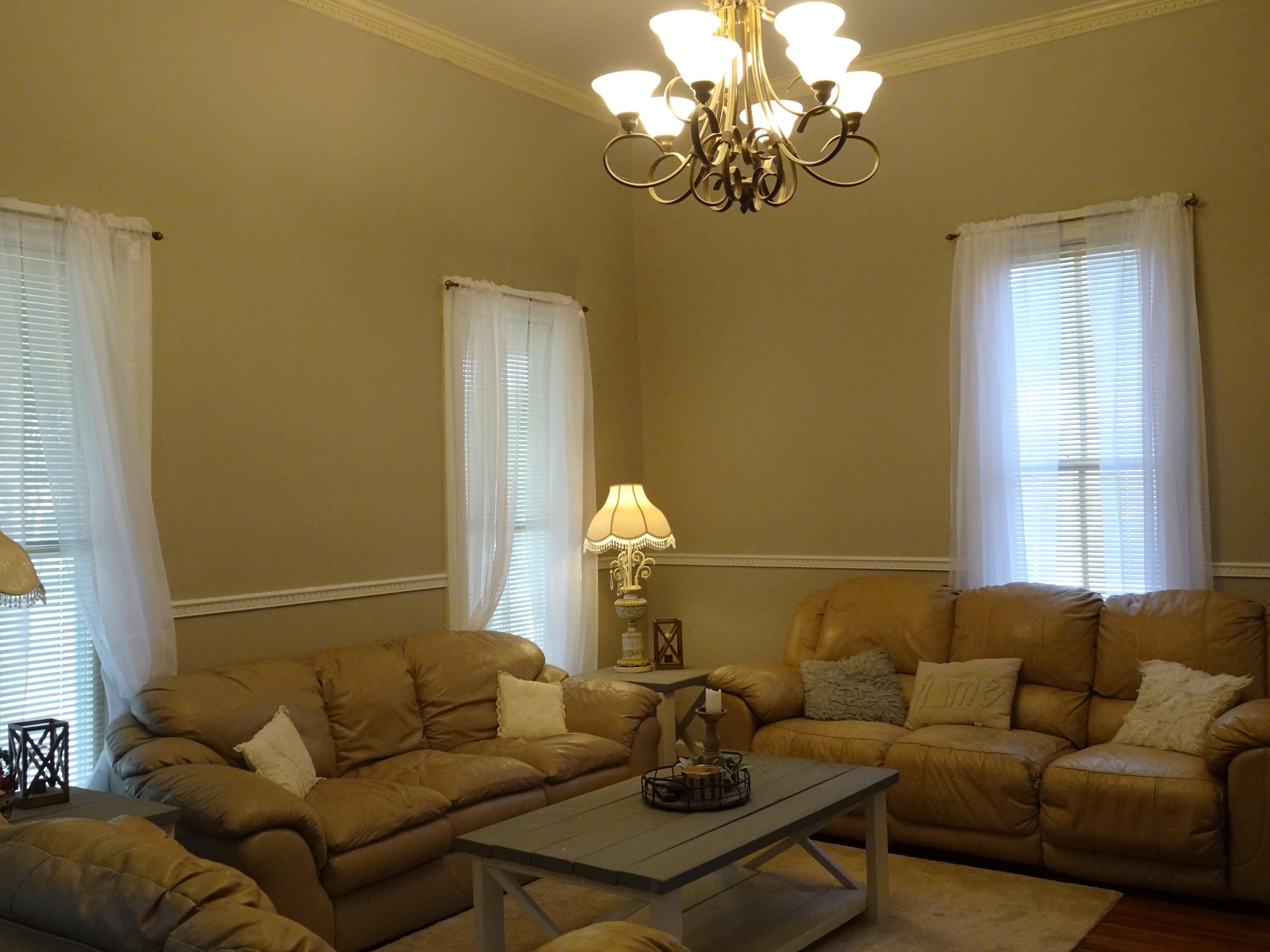910 5th Street Florala, AL 36442 - Photo 2 of 34 a living room with furniture a chandelier and a window