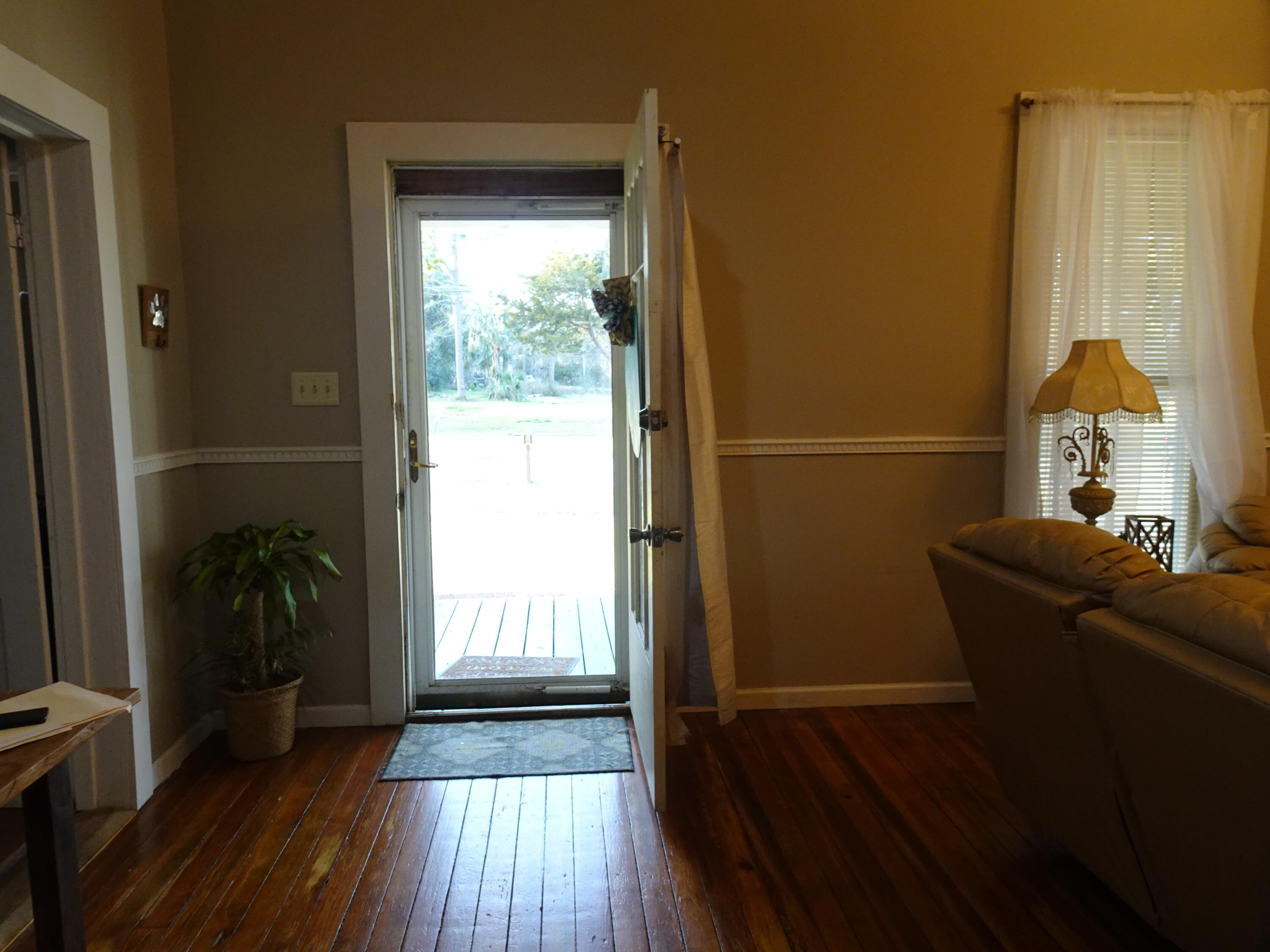 910 5th Street Florala, AL 36442 - Photo 34 of 34 a living room with furniture and a wooden floor