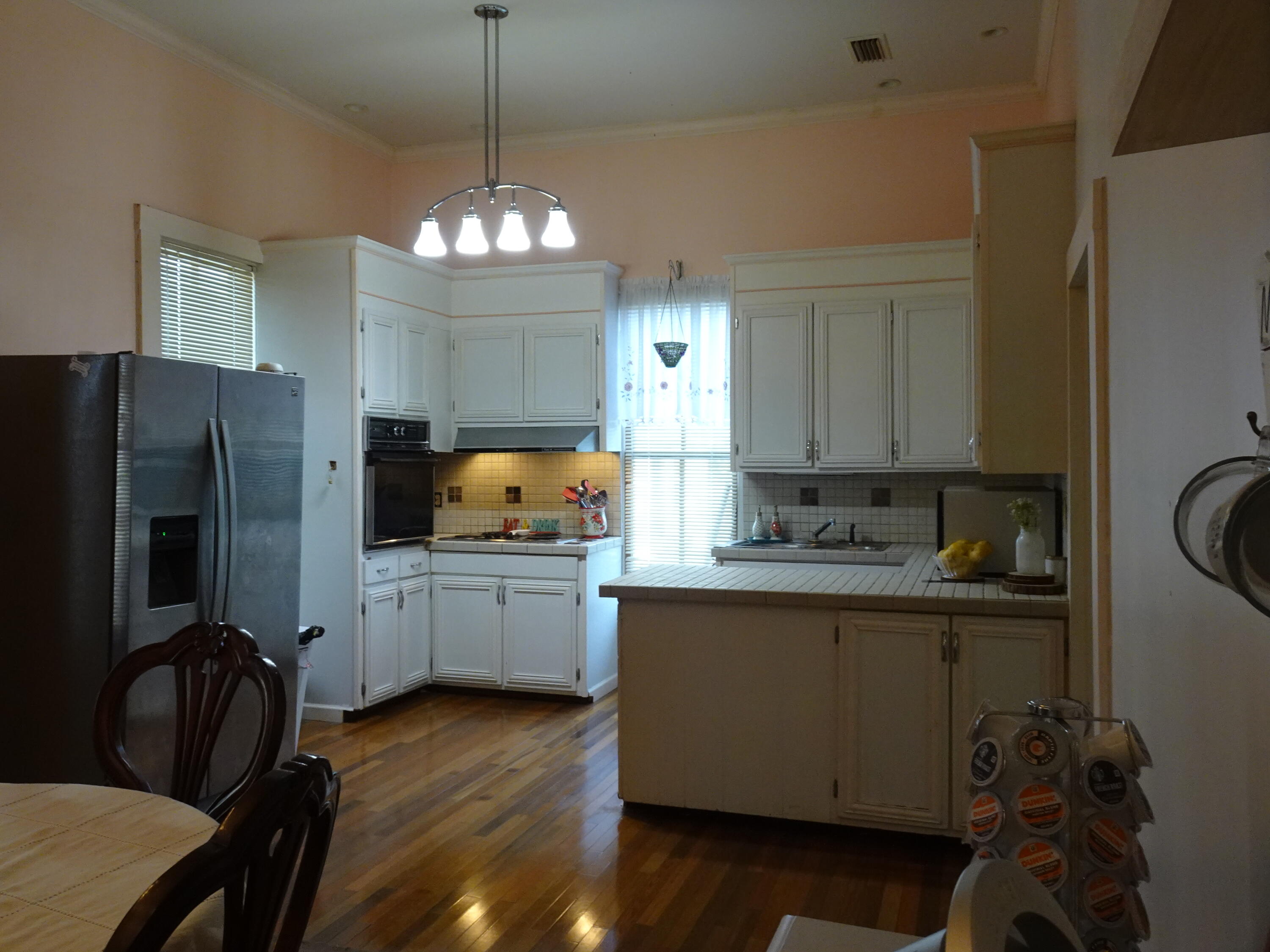 910 5th Street Florala, AL 36442 - Photo 9 of 34 a kitchen with sink refrigerator and microwave