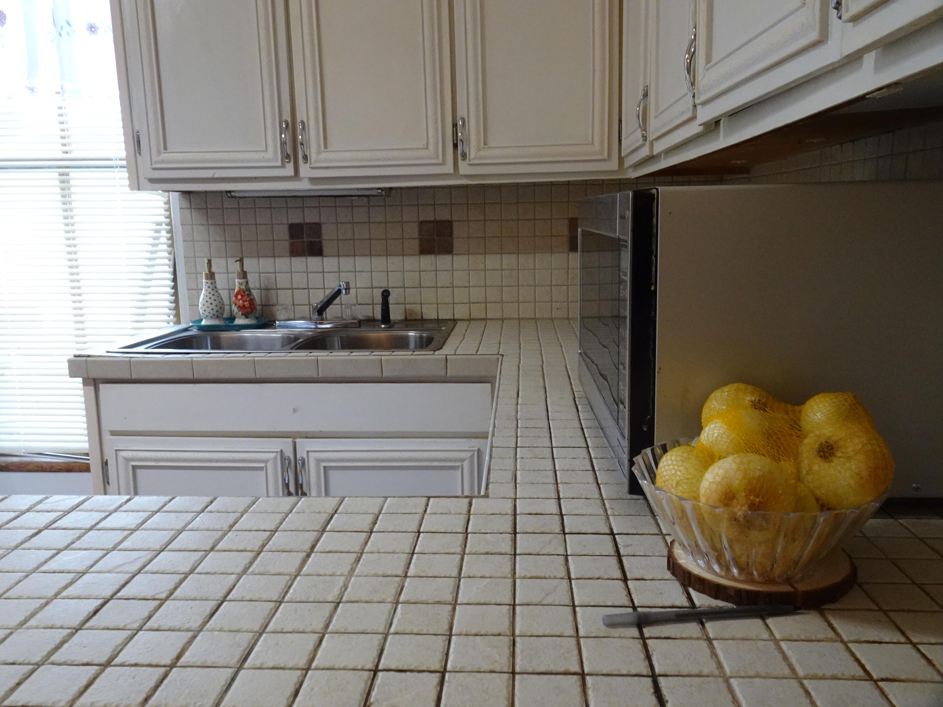 910 5th Street Florala, AL 36442 - Photo 10 of 34 a kitchen with a sink and cabinets