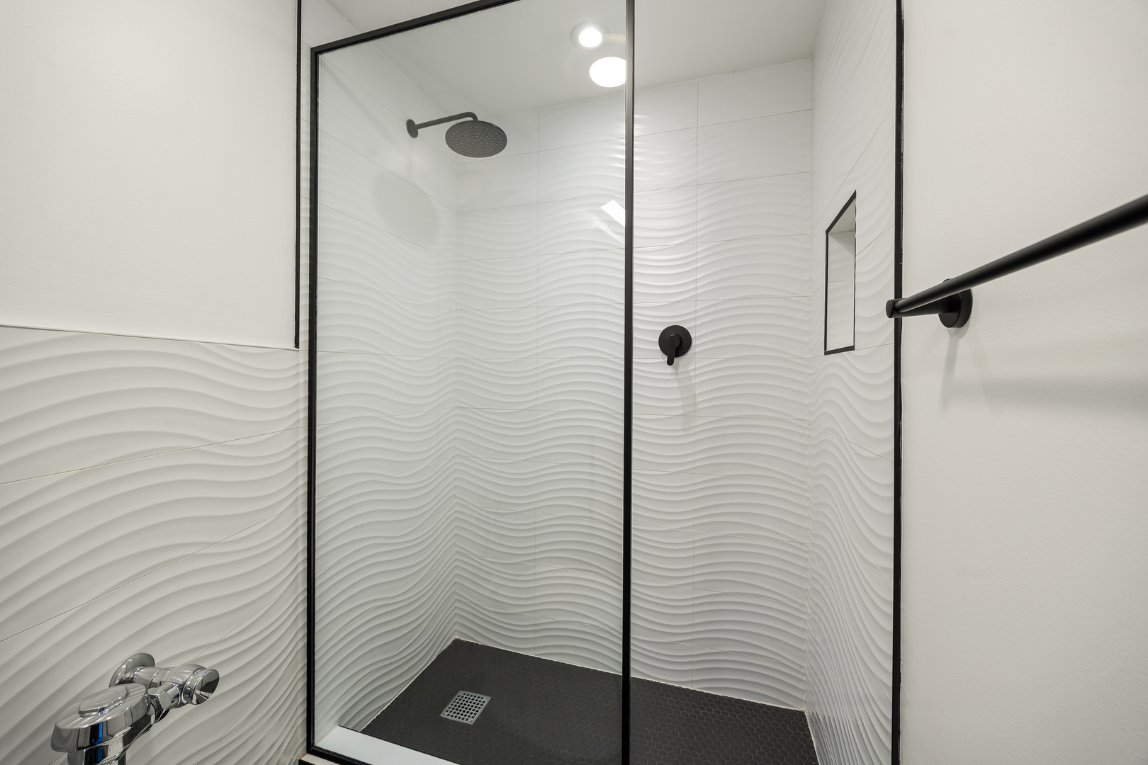 300 North State Street, Unit 5506 Chicago, IL 60654 - Photo 18 of 28 a bathroom with a shower and a sink