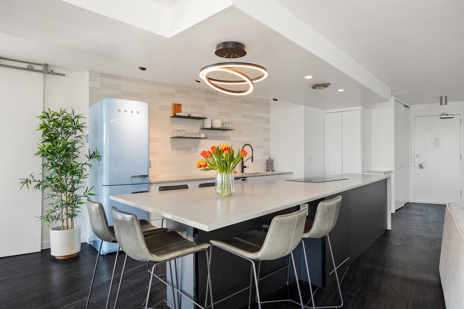 300 North State Street, Unit 5506 Chicago, IL 60654 - Photo 2 of 28 a view of a dining room with furniture and wooden floor