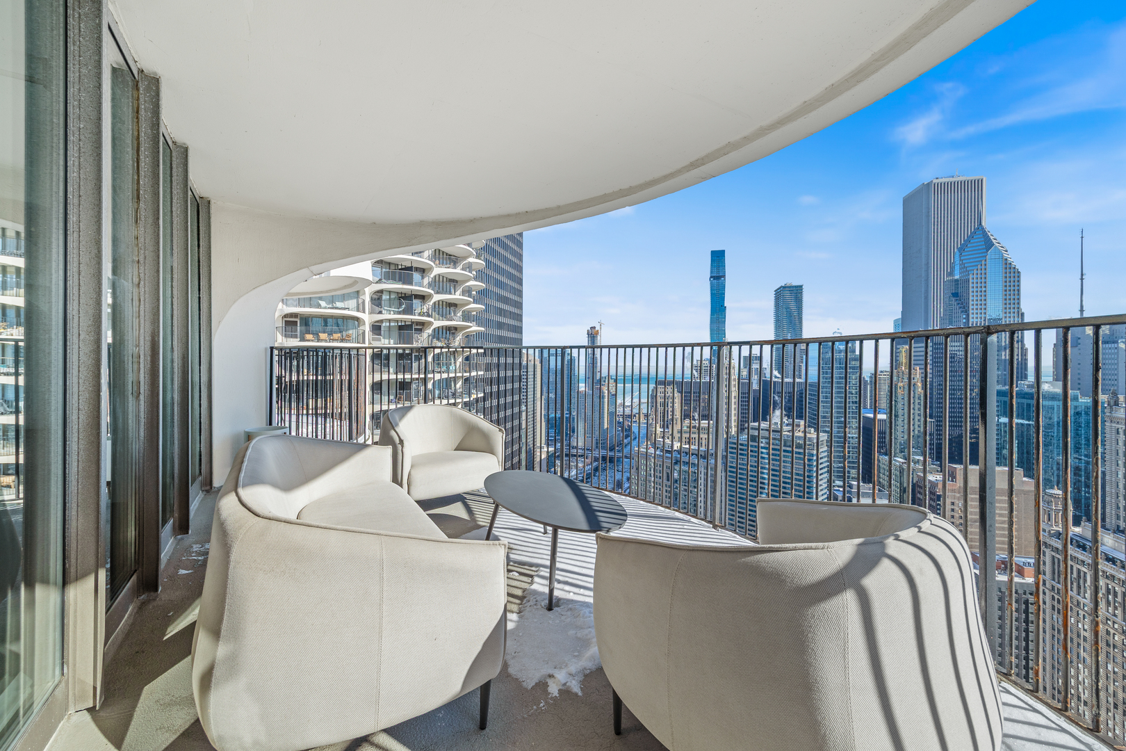 300 North State Street, Unit 5506 Chicago, IL 60654 - Photo 21 of 28 a living room with furniture and a window
