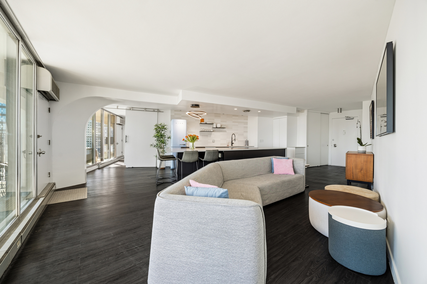 300 North State Street, Unit 5506 Chicago, IL 60654 - Photo 5 of 28 a living room with furniture and a wooden floor