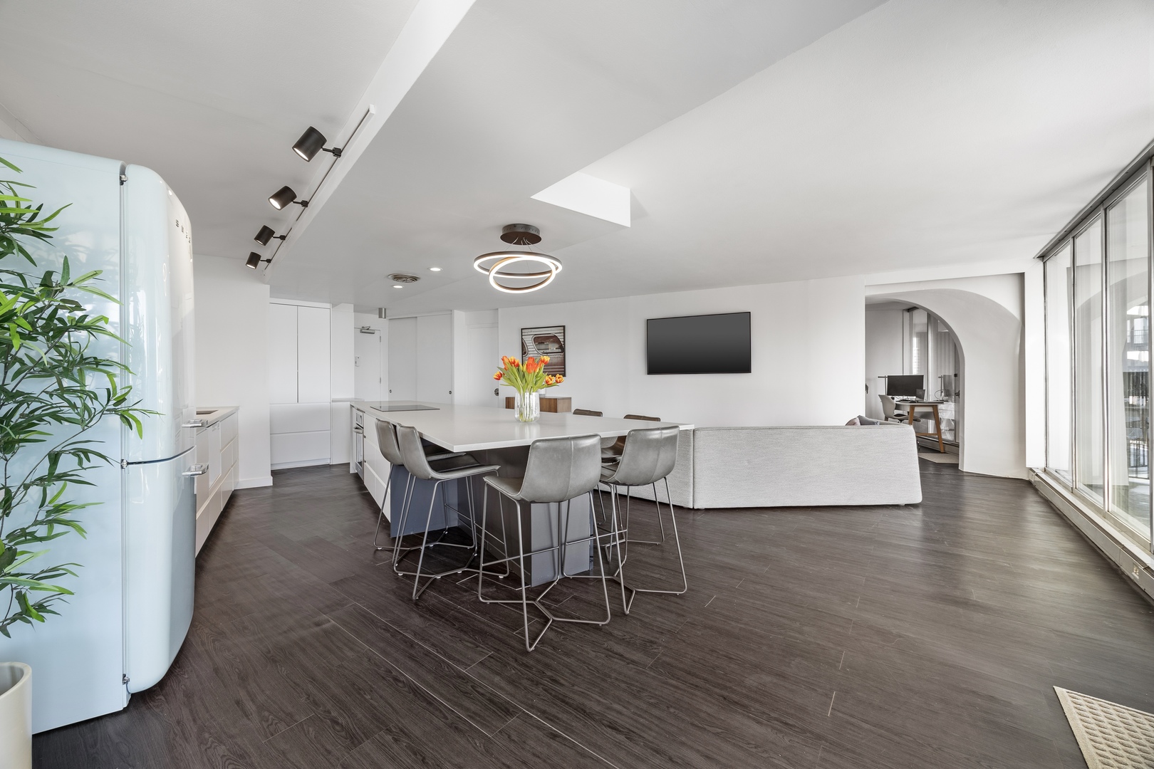 300 North State Street, Unit 5506 Chicago, IL 60654 - Photo 6 of 28 a view of a dining room with furniture and wooden floor