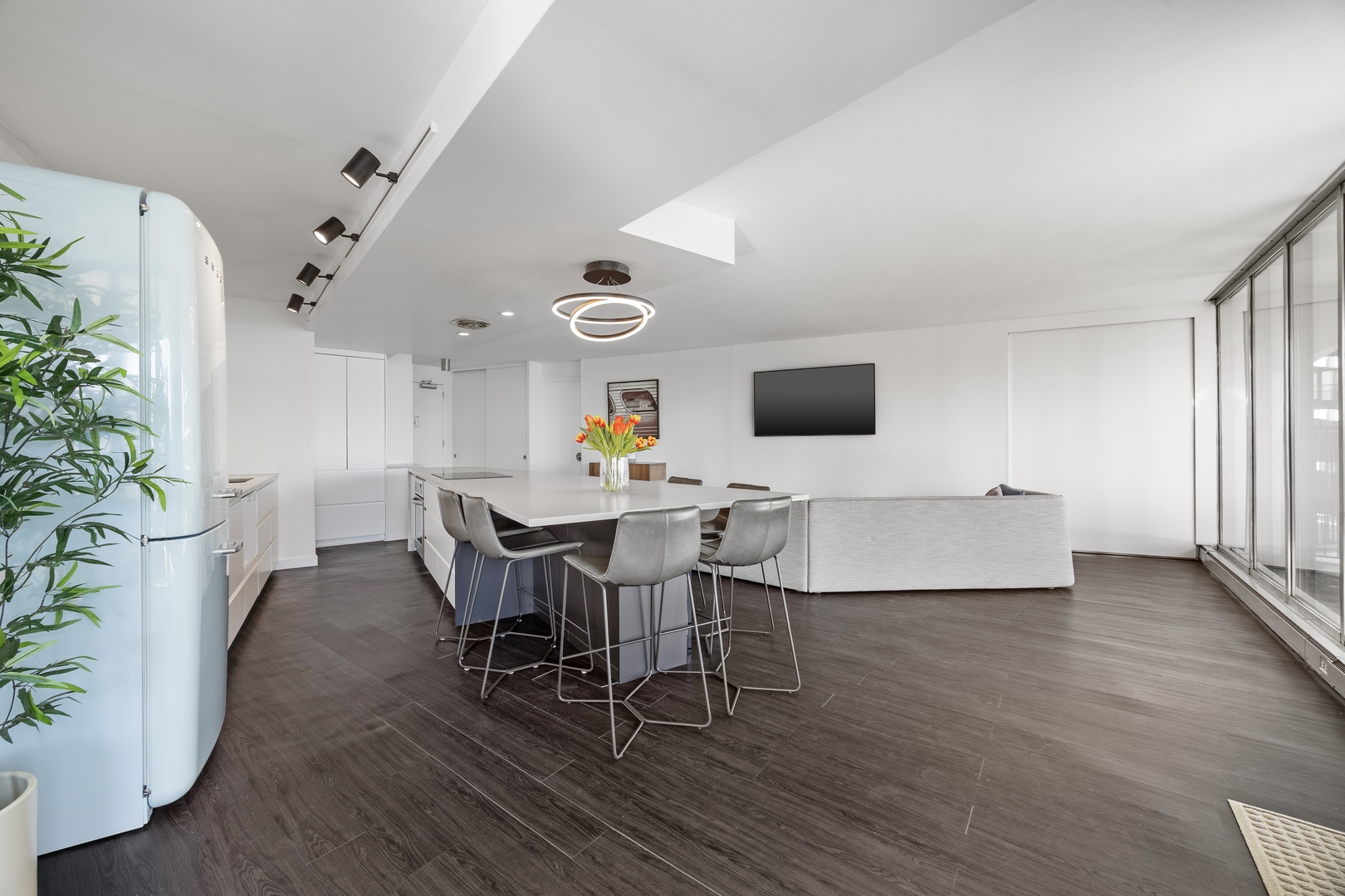 300 North State Street, Unit 5506 Chicago, IL 60654 - Photo 7 of 28 a view of a dining room with furniture and wooden floor