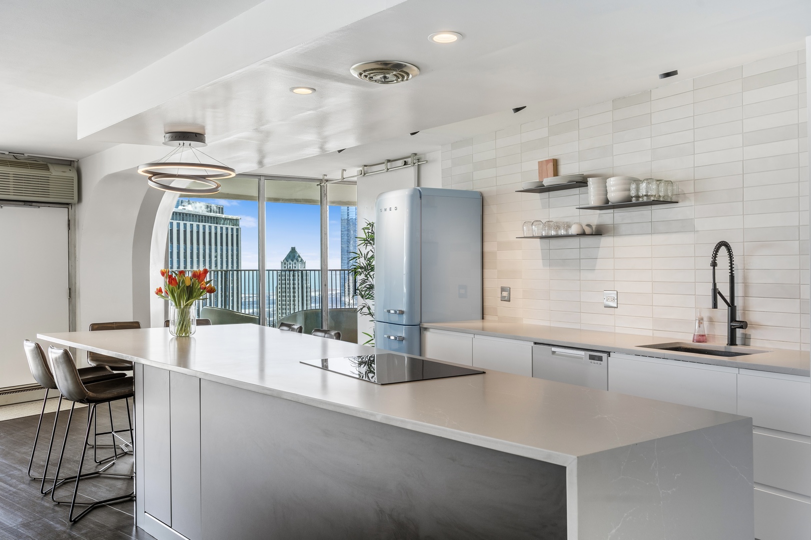 300 North State Street, Unit 5506 Chicago, IL 60654 - Photo 8 of 28 a kitchen with counter top space and dining table