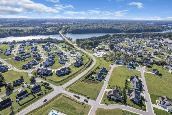 an aerial view of a residential houses with outdoor space