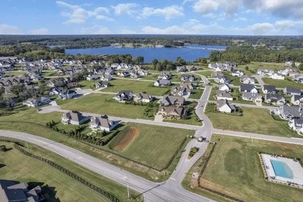 an aerial view of a residential houses with outdoor space
