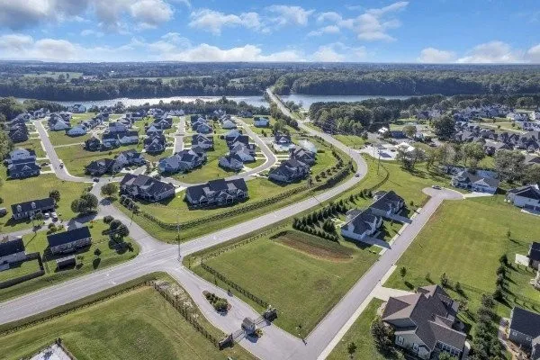 an aerial view of a residential houses with outdoor space
