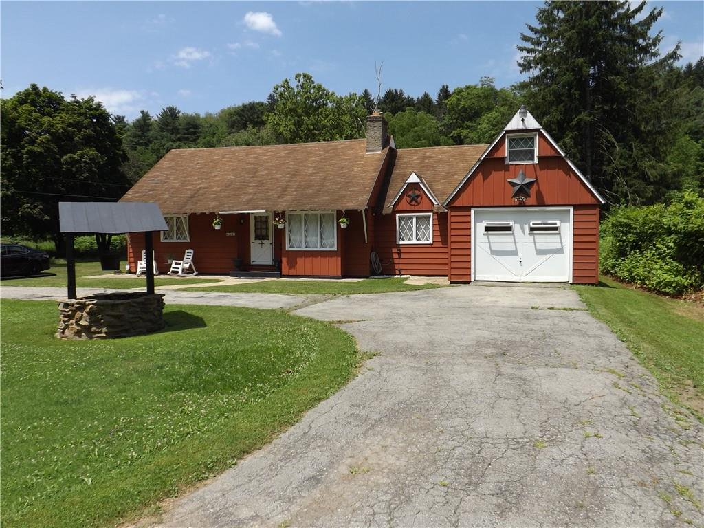 a front view of a house with yard
