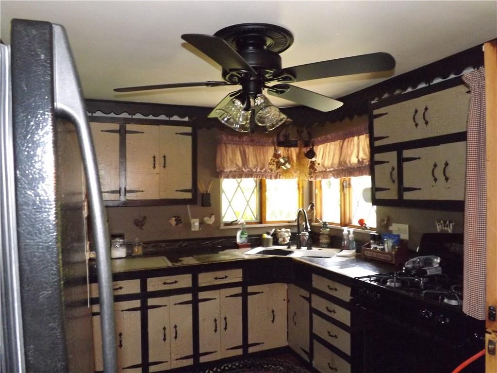 1641 Dime Road Vandergrift, PA 15690 - Photo 11 of 23 a kitchen with a sink cabinets and window