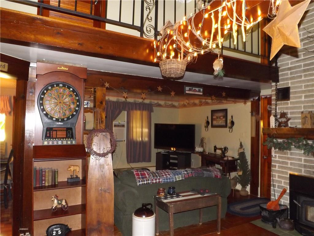 1641 Dime Road Vandergrift, PA 15690 - Photo 2 of 23 a living room with fireplace furniture and a flat screen tv