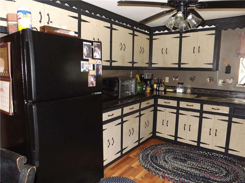 1641 Dime Road Vandergrift, PA 15690 - Photo 10 of 23 a kitchen with stainless steel appliances granite countertop a refrigerator a sink and white cabinets