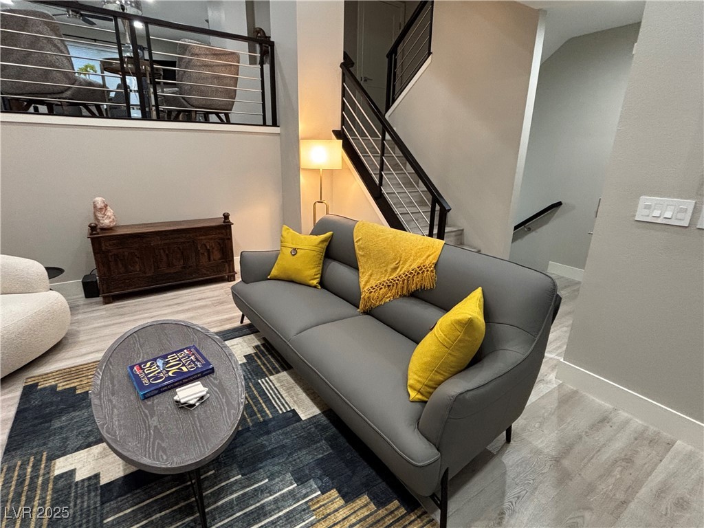 2784 Fountain Ridge Lane Henderson, NV 89074 - Photo 12 of 37 Living area featuring wood finished floors and stairway