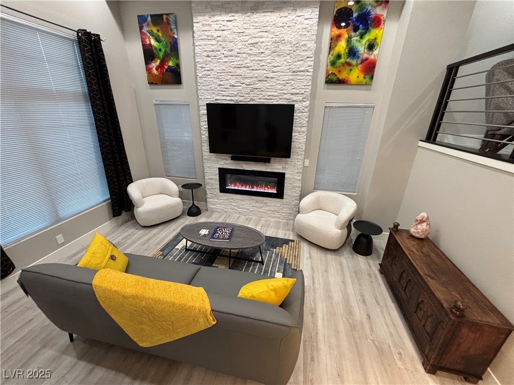 2784 Fountain Ridge Lane Henderson, NV 89074 - Photo 14 of 37 Living area featuring wood finished floors and a large fireplace