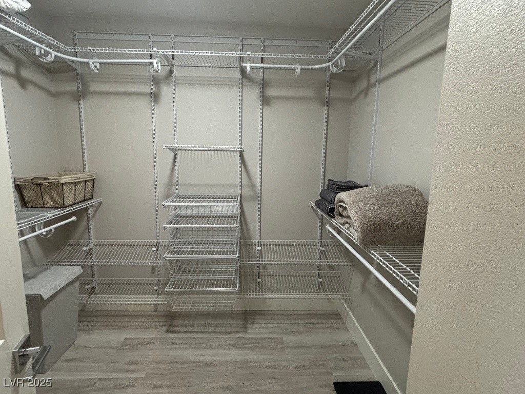 2784 Fountain Ridge Lane Henderson, NV 89074 - Photo 27 of 37 Walk in closet featuring light wood finished floors