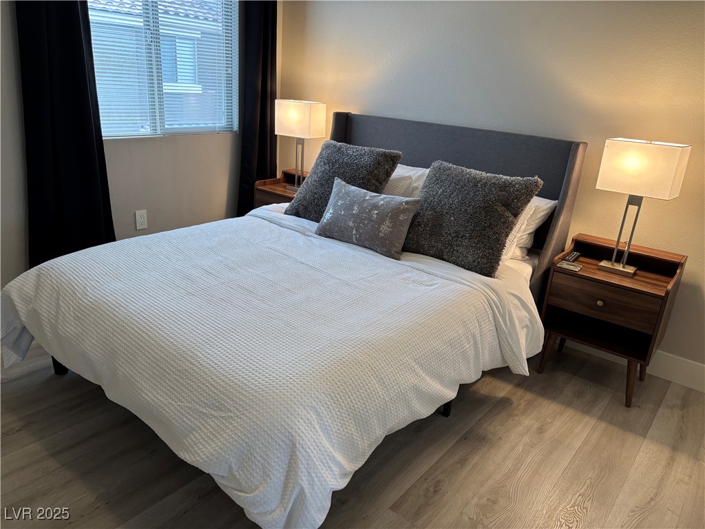 2784 Fountain Ridge Lane Henderson, NV 89074 - Photo 34 of 37 Bedroom featuring wood finished floors and baseboards
