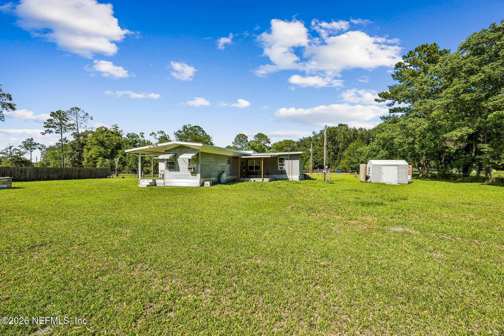 15690 Sears Road Jacksonville, FL 32218 - Photo 20 of 27 a front view of a house with garden