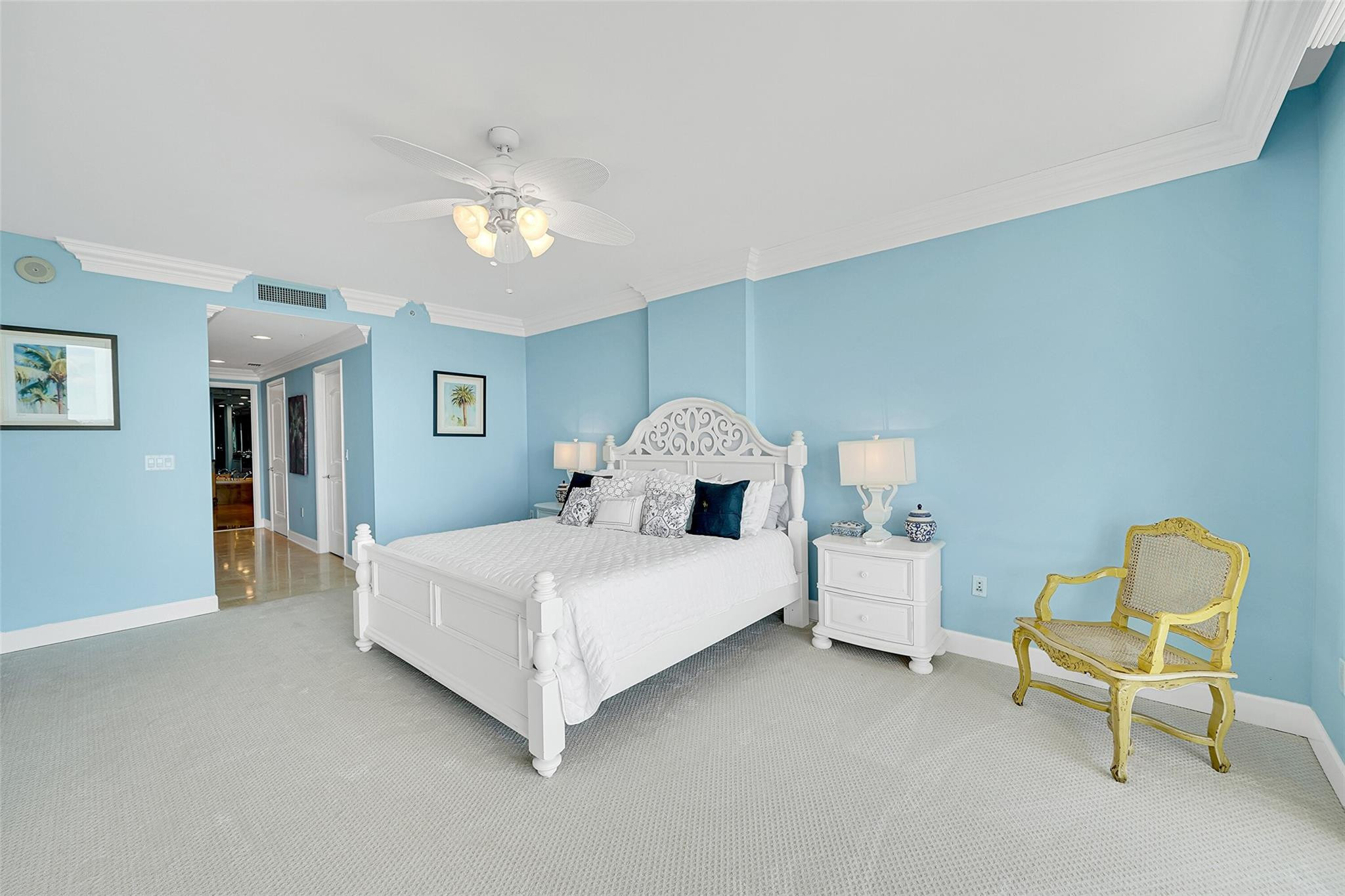 821 North Riverside Drive, Unit PH2 Pompano Beach, FL 33062 - Photo 47 of 95 a spacious bedroom with a bed and a chair