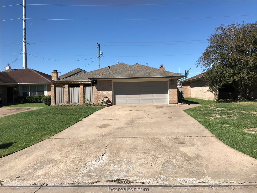 2917 Braeburn Bryan, TX 77802 - Photo 1 of 1 a front view of a house with a yard