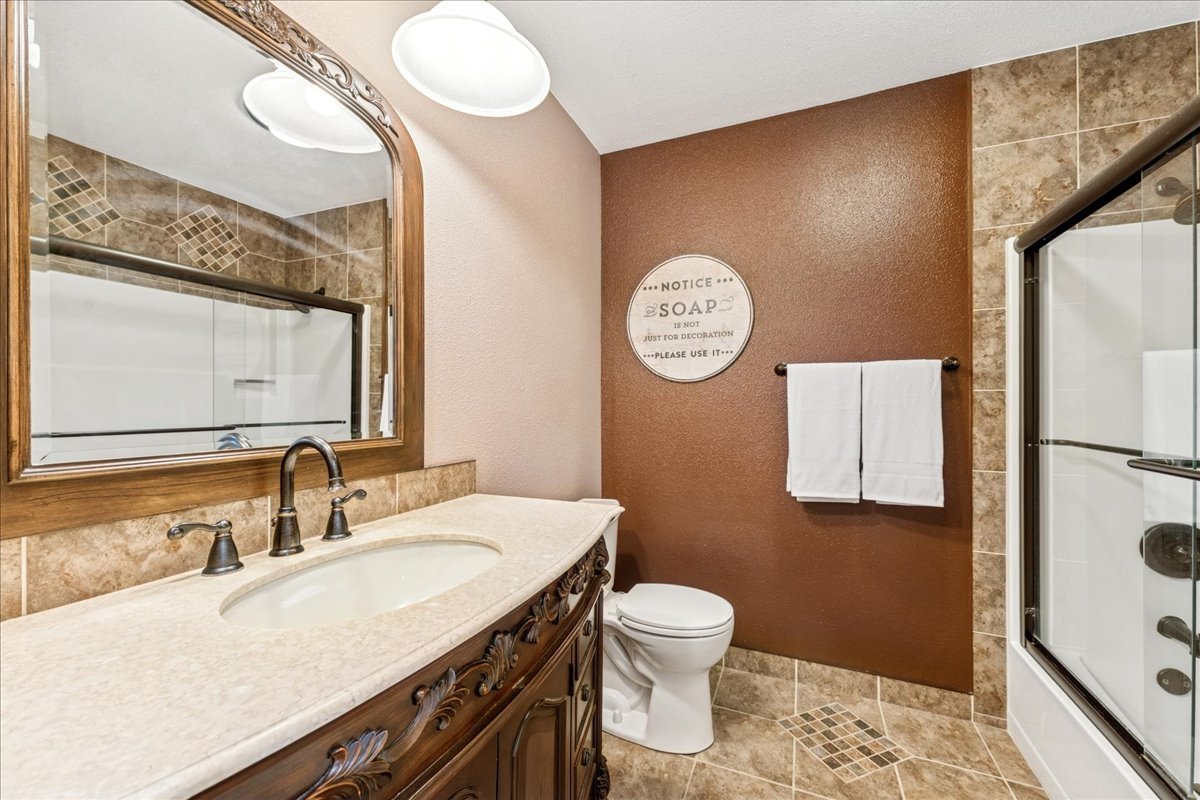 305 Pearl Street Cary, IL 60013 - Photo 13 of 25 a bathroom with a sink and a mirror