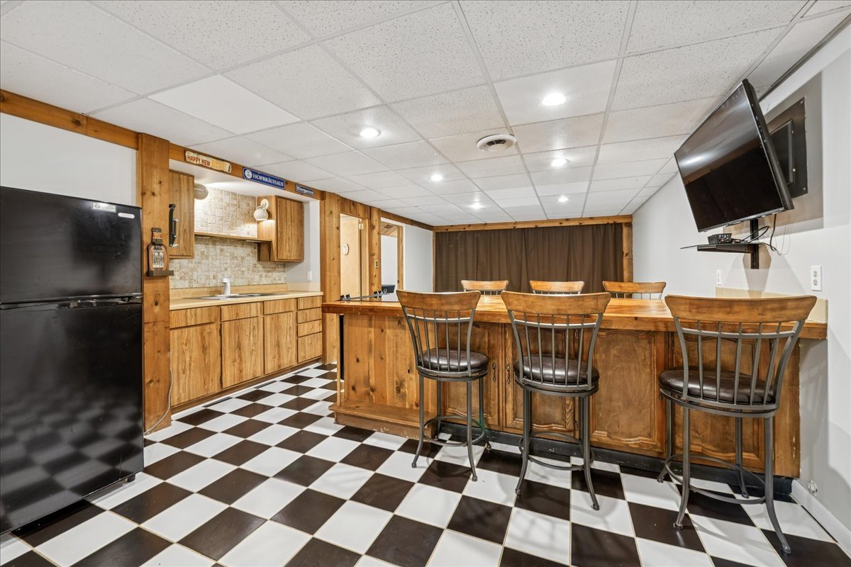 305 Pearl Street Cary, IL 60013 - Photo 15 of 25 a kitchen with a sink a counter and stainless steel appliances
