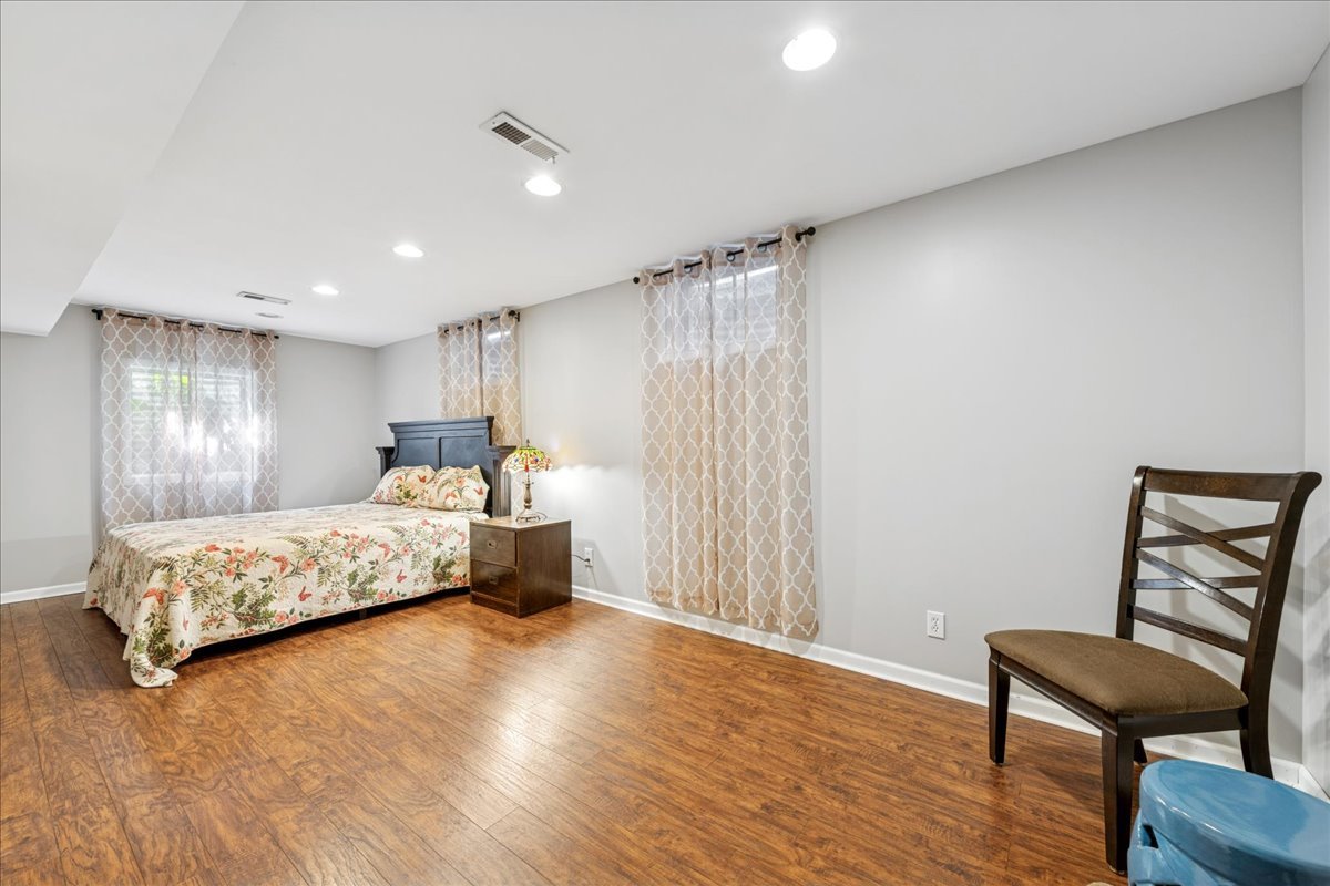 305 Pearl Street Cary, IL 60013 - Photo 18 of 25 a bedroom with a bed and a chair